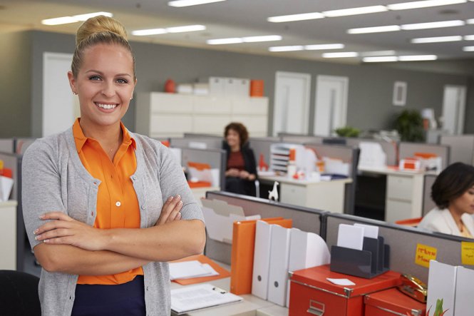 Smiling woman in office.
