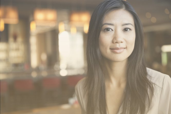 A woman in a store or other small business.