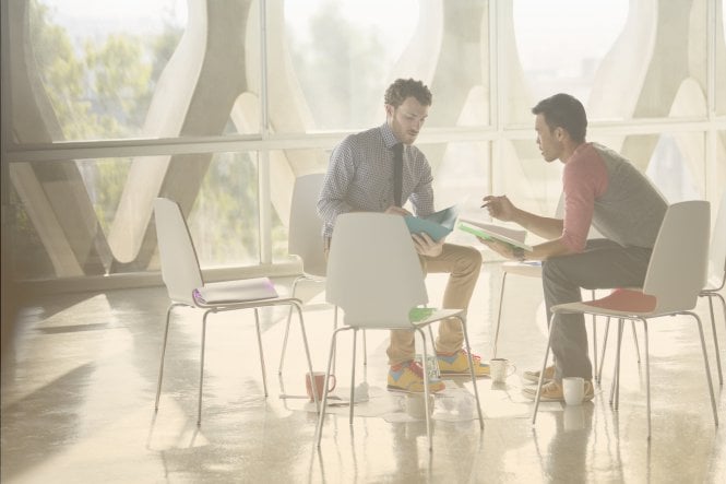 Two employees making sound decisions thanks to cloud technology for small-business growth.