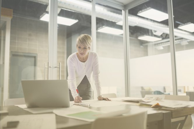 A woman using business productivity tools to work more efficiently.