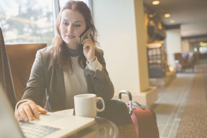 A woman using business communication and technology to more effectively track her billable hours.