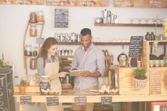 A man and woman using personalization in retail to provide a superior customer experience.