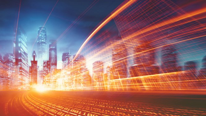A stream of digital graphics over a city skyline, representing the speed of disruptive innovation.