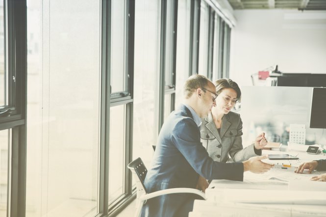 Executives reviewing SIP trunk providers in their office.