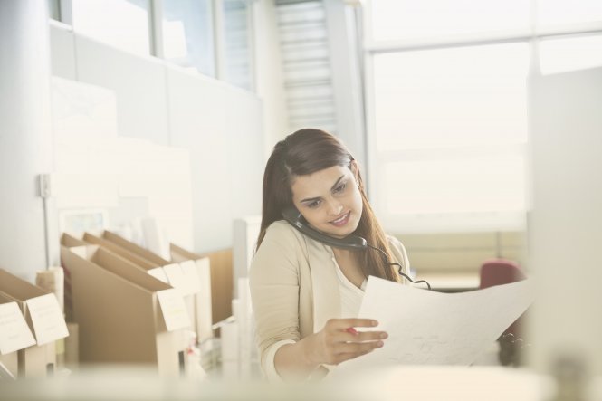 An employee makes a phone call supported by an SD-WAN product.