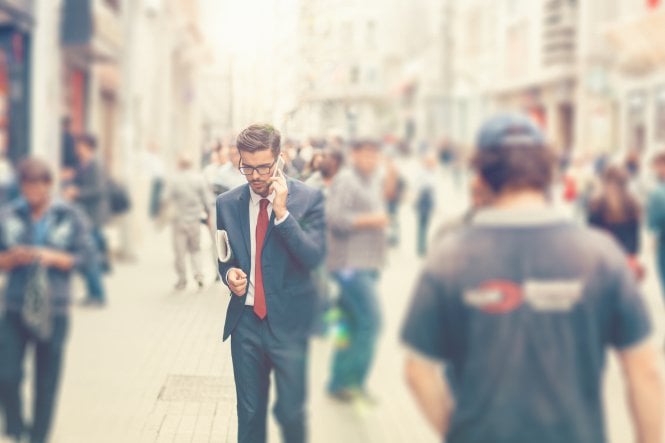 Salesman fielding a call on the go with Oracle cloud integration