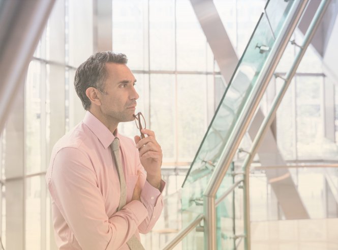 Businessman considers the benefits of communications technology.