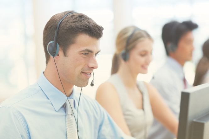Customer service associates work in a call or contact center.