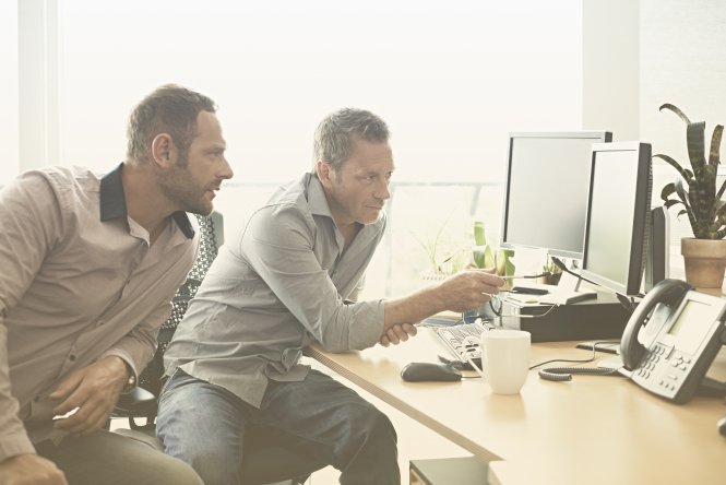 One IT worker explains the benefits of UCaaS vs. CPaaS to another