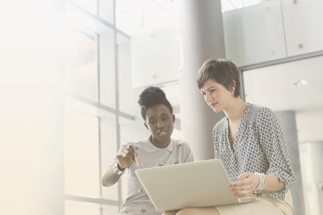 Two professional women discuss options in the CPaaS market.