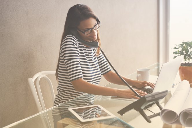 A woman uses NetSuite integration across various platforms