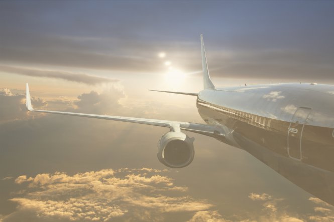 A plane soars through the air, passengers having received excellent travel communication