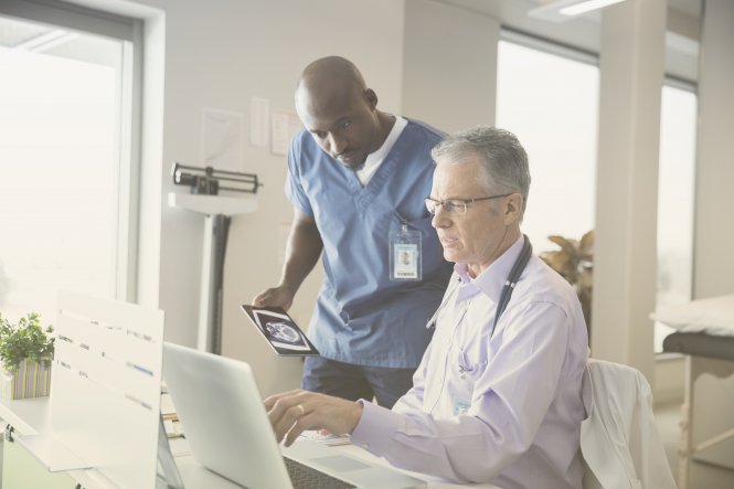 Doctors collaborating through a hospital's strong organizational culture