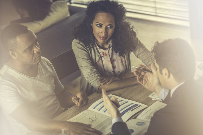 Banker who benefits from cloud implementation talking to clients