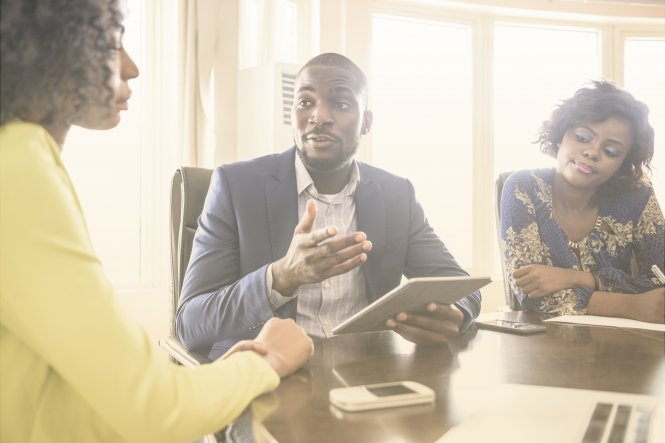 Vonage channel partner communicating UCaaS benefits to enterprise leaders via a tablet