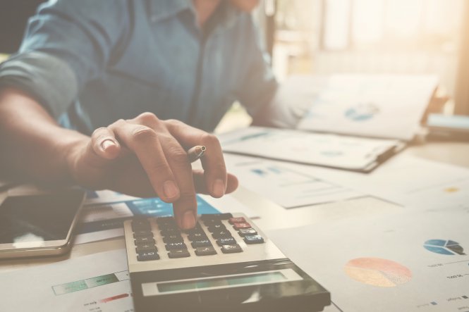 Accountant using mobile device and calculator to streamline communication