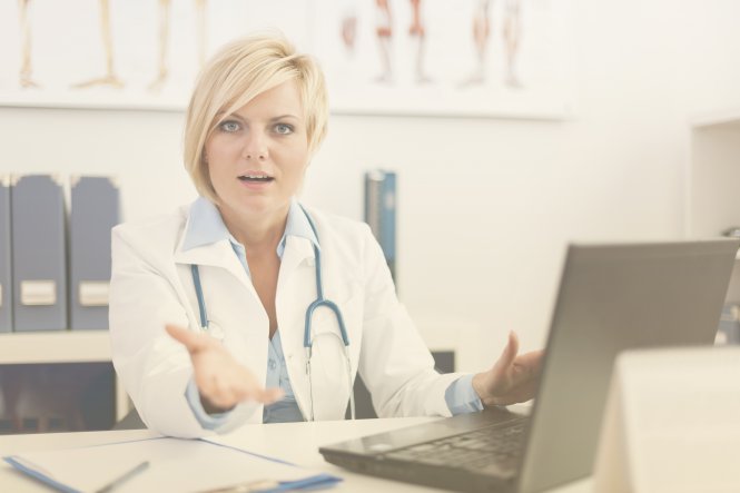 Doctor discussing HIPAA compliant cloud technology with a patient