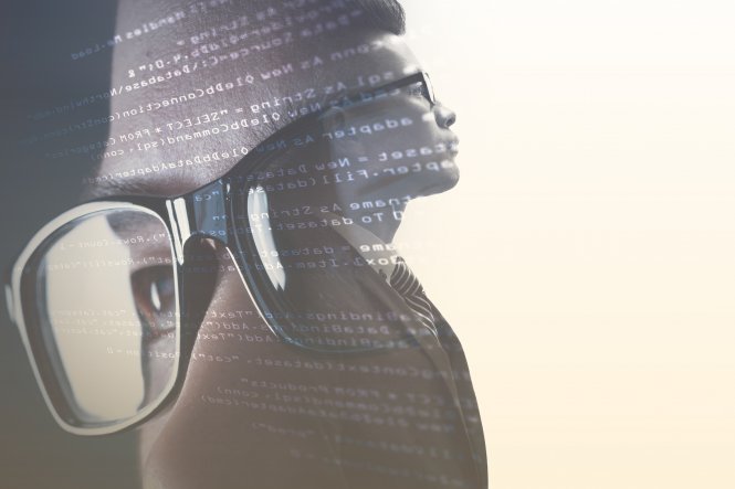 Close-up of person's face laid on top of code and a person's torso — UCaaS use cases