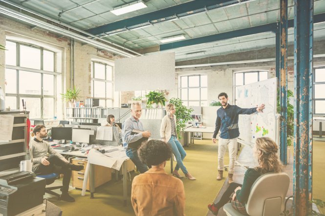 Group exhibiting strong employee communication in a casual business environment