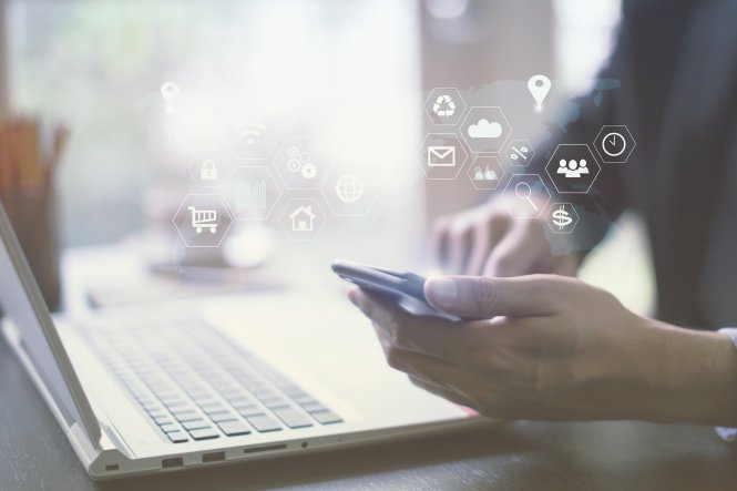 Person using smartphone with symbols representing artificial intelligence and unified communications