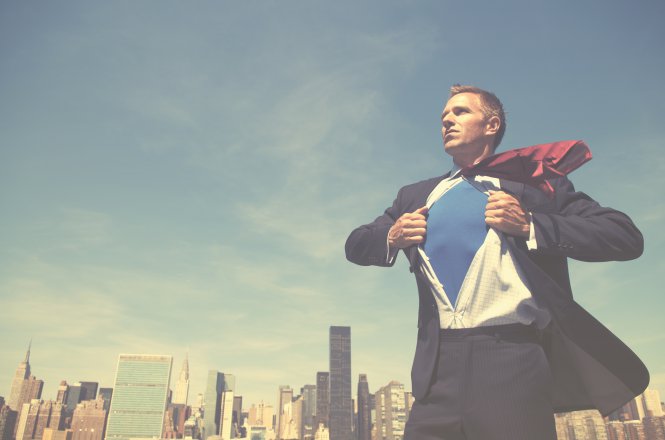 Person against cityscape opening button-down shirt — communication best practices in the workplace