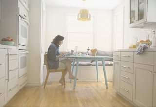 Woman works from home, wondering "How does the cloud work for teleworkers?"
