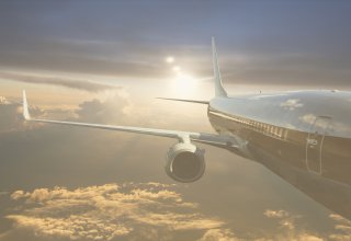 A plane soars through the air, passengers having received excellent travel communication
