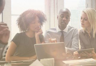 Team members considering the roles needed to implement a cloud strategy
