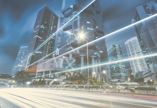 Landscape of urban skyscrapers with speed lines representing SD-WAN benefits