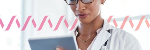 Photo of a female doctor reviewing a tablet