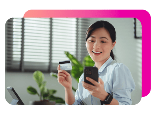 image of a woman using phone and ATM card