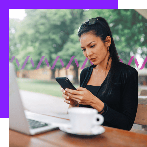 Photoillustration of a woman holding a cell phone with a laptop and a coffee cup in background