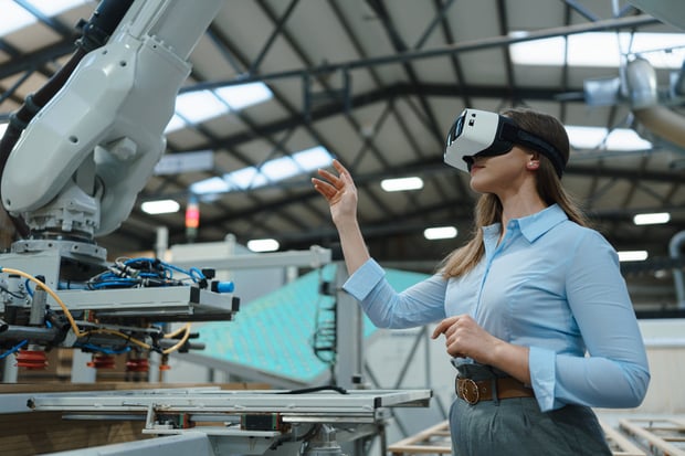 Female engineer using VR, in modern industrial factory. Virtual reality and technology in manufacturing industry, Smart glasses guiding manager through process and planing.