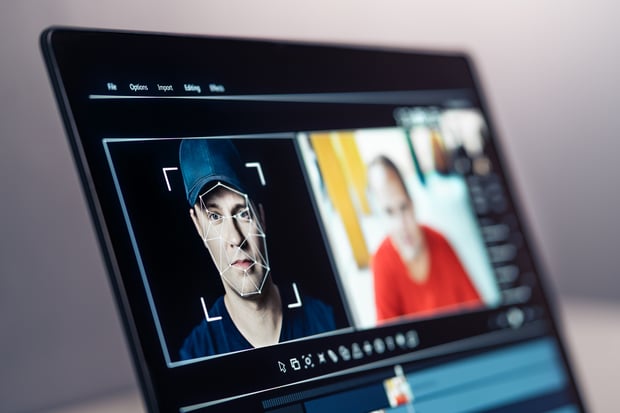 Deep fake, AI and face swap in video edit. Deepfake and machine learning. Facial tracking, detection and recognition technology. Digital identity interchange. Computer software mockup. Fraud picture.