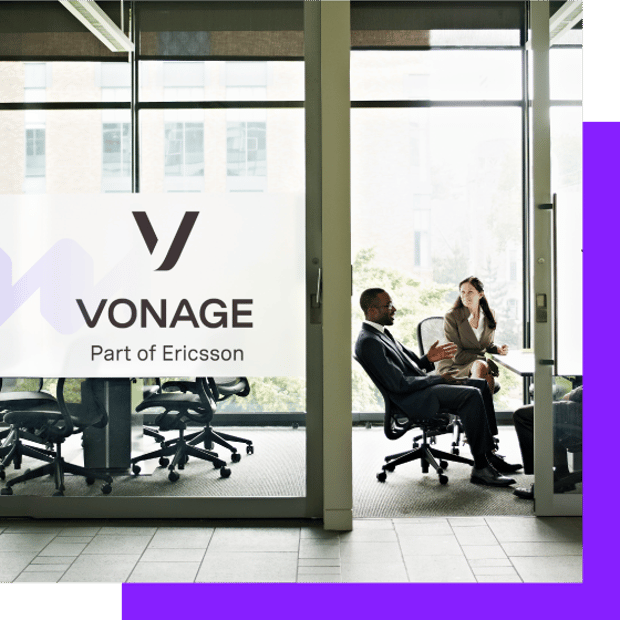 Image of people talking in a Vonage conference roomfor What Does Vonage Do blog article