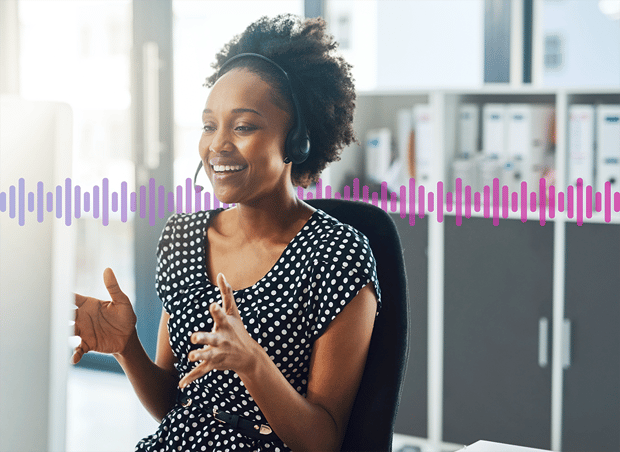 A sales agent talking to a customer on a headset