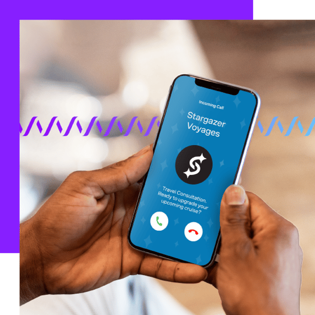 Close-up photo of a man's hands holding a cell phone. On the screen is displayed the name of the company calling and other information. In the background, a series of small purple wave forms runs across the frame.