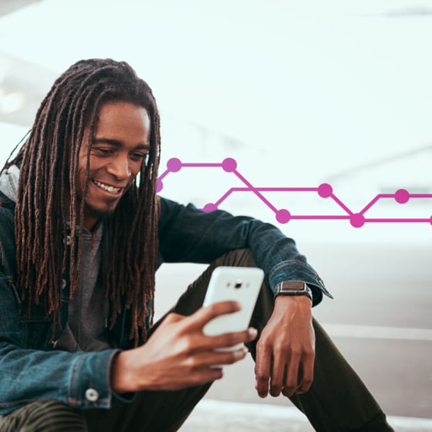 API SEO AI Knowledge Base Blog Header Illustration of a smiling man looking at the cell phone he is holding his in his hand. He is sitting down in a non-specific location, and the background is blurred. Behind the man, a series of purple connected lines and dots runs across the frame.