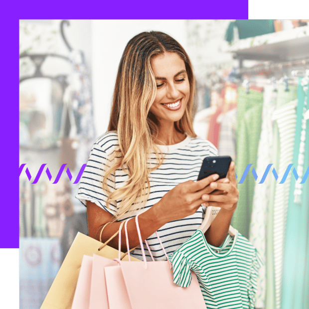 Photo of a smiling customer shopping for clothes in a store. She is looking at her phone and texting. In the background, a series of purple-to-blue wave forms runs across the frame.