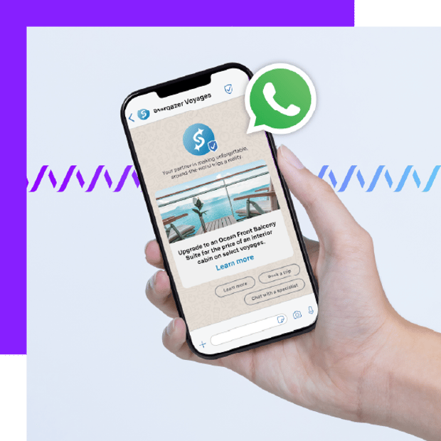 Photo of a hand holding a cell phone. On the screen are the details of an ongoing WhatsApp interaction. In the background, a series of small wave forms runs across the frame.