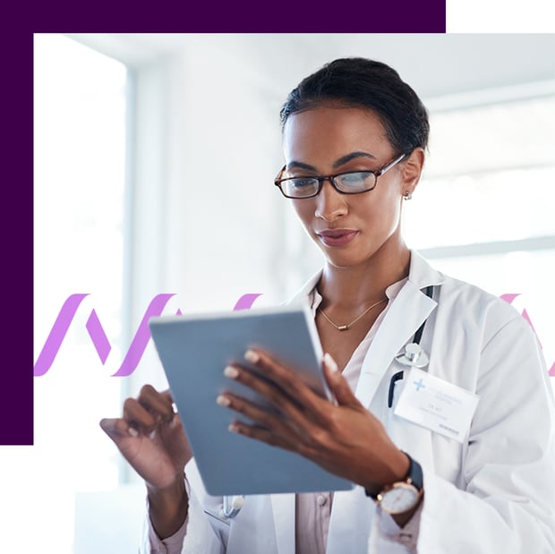 Photo of a female doctor wearing a white coat and in a hospital or clinic setting working with her tablet. In the background, a purple waveform icon runs across the frame.