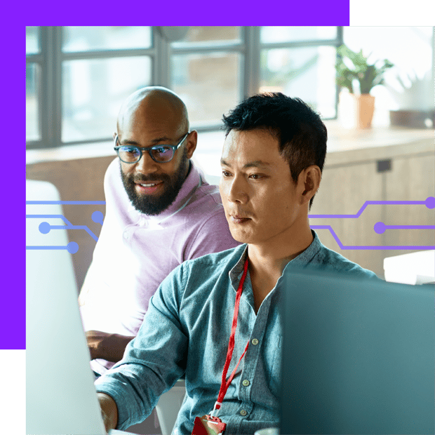 Two men looking at a computer monitor