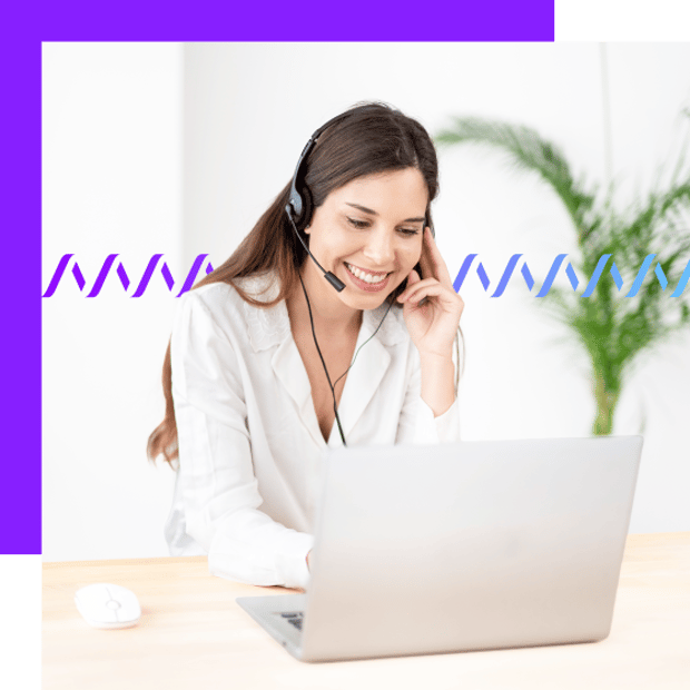 Photo of a smiling female employee working in an office setting. She is wearing a headset while she works on her laptop. In the background, a series of small wage forms runs across the frame.