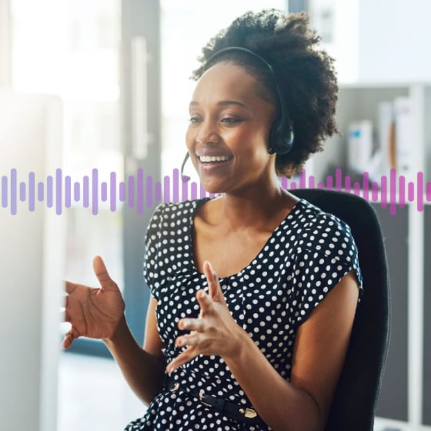 CC SEO Quality Assurance Blog Header Photo of a smiling contact center agent talking to a customer through her phone headset. In the background, a series of small gradient purple lines run across the frame.
