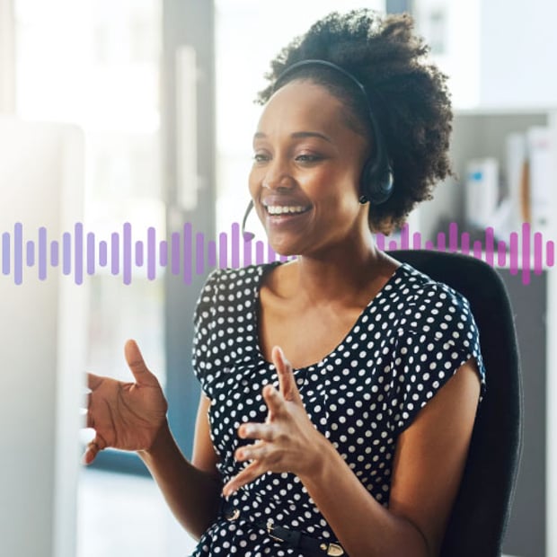 Photo of a smiling contact center agent talking to a customer through her headset. In the background, a series of small vertical purple gradient lines runs across the frame.