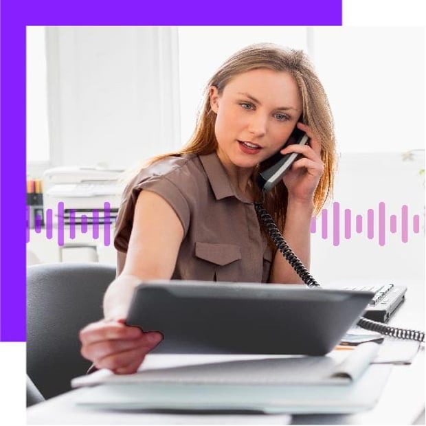 UC SEO POTS Integration Blog Header Photo of a woman looking at some documents while talking on her business phone. In the background, a series of small purple vertical lines runs across the frame.