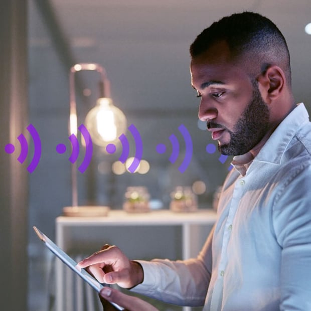 UC VoIP Test SEO Blog Header Photo of an employee testing business VoIP call quality and network performance on a tablet.