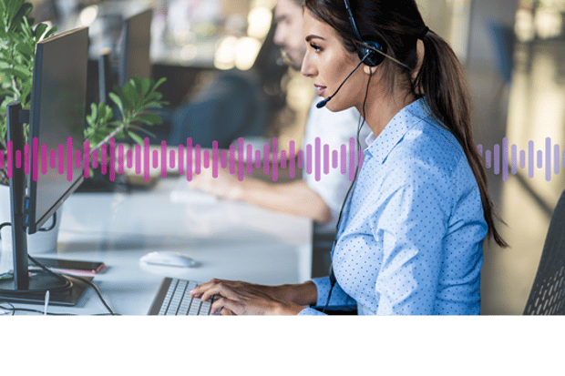Call center agent A woman wearing a headset and looking at a computer screen