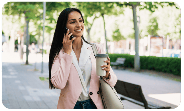 Woman Checking Voicemail Photo of woman walking checking voicemail