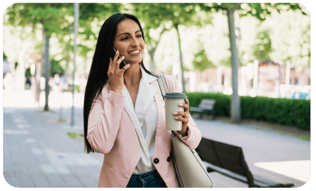 Photo of woman walking checking voicemail